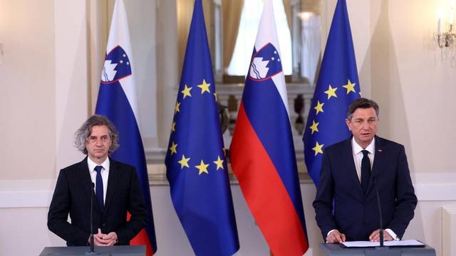 Slovenia's President Borut Pahor and the winner of Parliamentary elections Robert Golob address a news conference after an informal meeting in Ljubljana