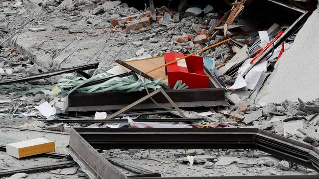 Debris are seen outside a damaged hotel after an earthquake hit Hualien