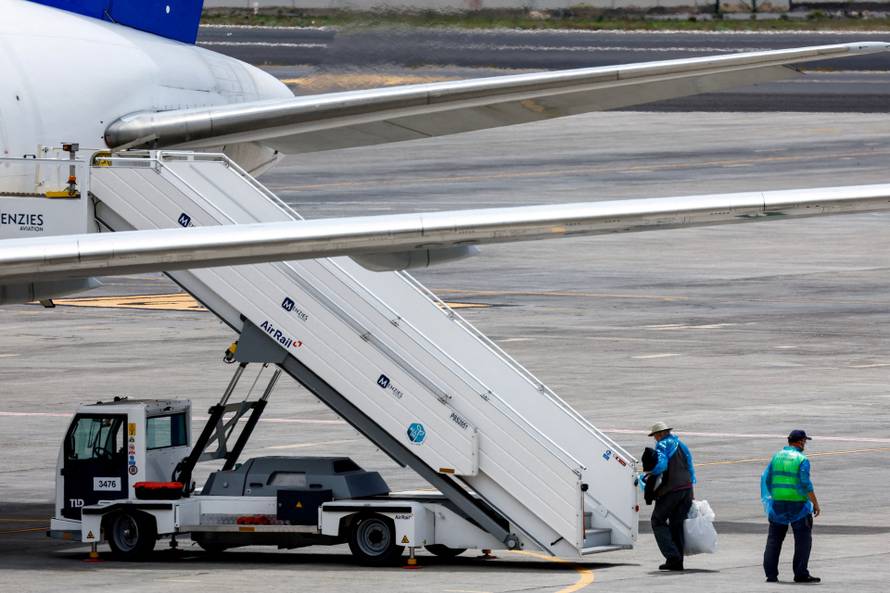 Passengers of the cruise ship MV Hondius, which was affected by a hantavirus outbreak, arrive at Tenerife Sud airport