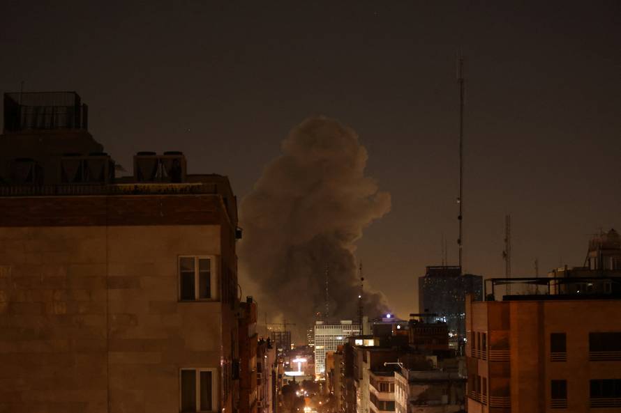 Smoke rises following an explosion, after Israel and the U.S. launched strikes on Iran, in Tehran