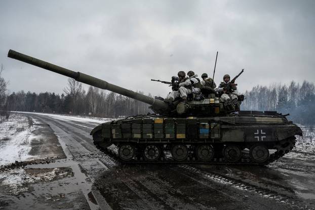 Ukrainian servicemen attend drills of armed forces at the border with Belarus near Chornobyl