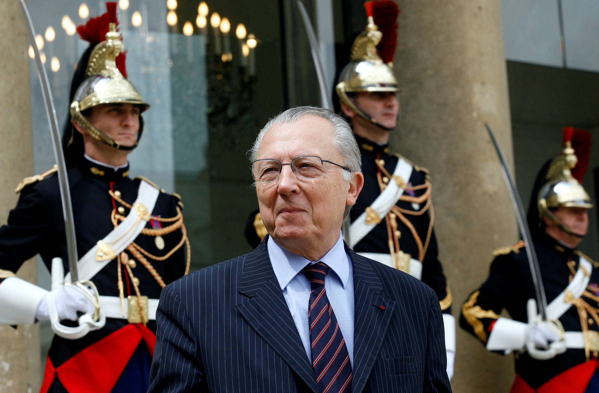 FILE PHOTO: Jacques Delors, former European commission President and former Socialist minister, leaves the Elysee Palace in Paris