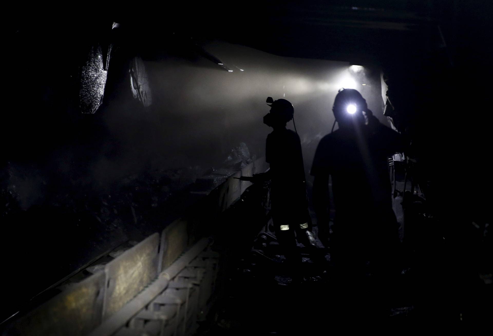 FILE PHOTO: Miners working about 500 meters underground at the Boleslaw Smialy coal mine, a unit of coal miner Kompania Weglowa (KW) in Laziska Gorne