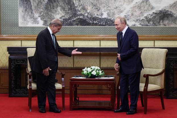 Russian President Vladimir Putin attends a meeting at Diaoyutai State Guesthouse in Beijing