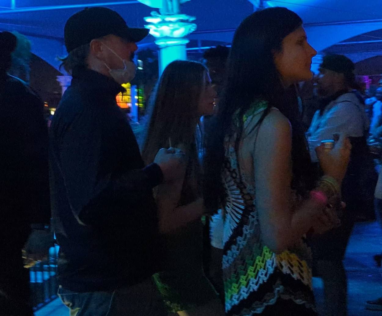 Leonardo DiCaprio parties with a group of girls at his VIP table at Coachella Festival