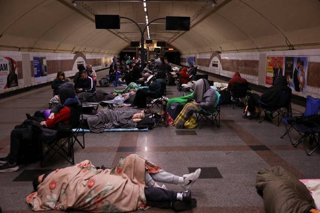 People take shelter during a Russian missile and drone strike, amid Russia's attack on Ukraine, in Kyiv