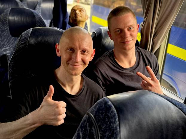 Ukrainian POWs are seen after a swap at an unknown location in Ukraine