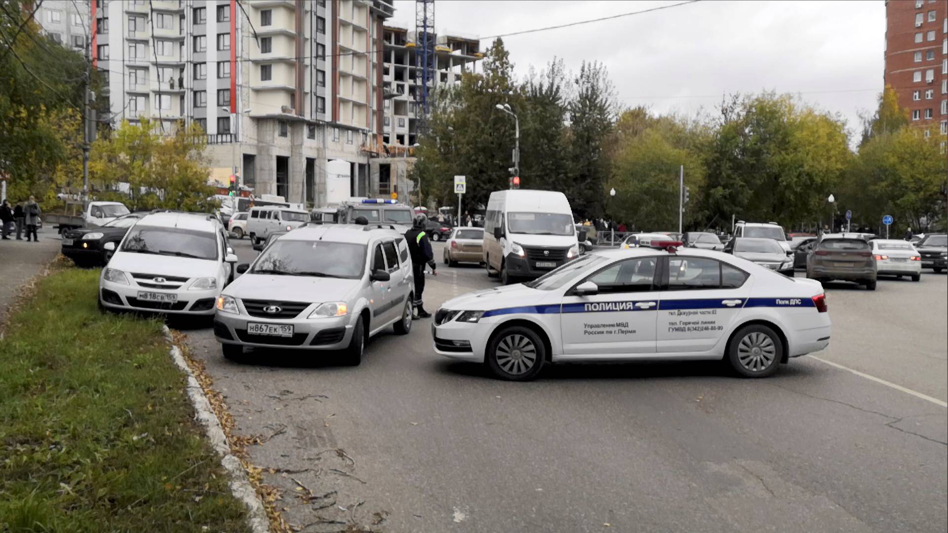 Police block the road near the scene of a shooting at university in Perm