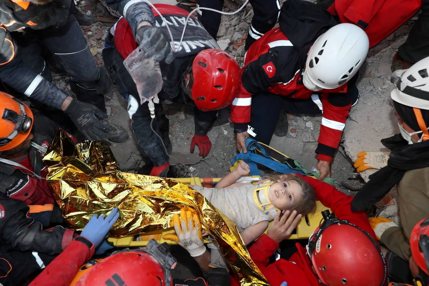 Rescue workers search for earthquake survivors in Izmir