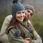 They love taking in the mountain views. A happy young couple enjoying the sights while hiking through the mountain.