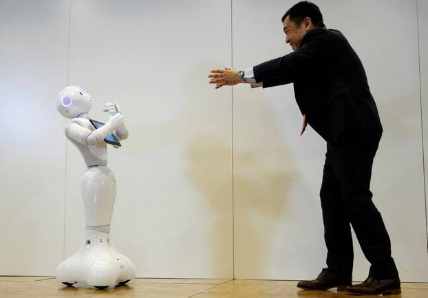 Board Director of Product Division for SoftBank Robotics Hasumi performs with SoftBank