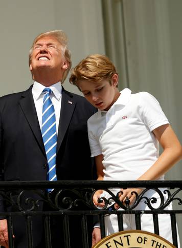 U.S. President Trump and family watch the solar eclipse from the White House in Washington