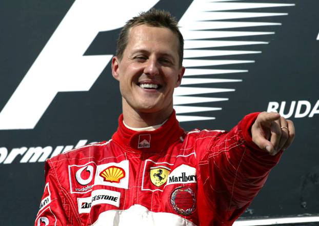 FILE PHOTO: Michael Schumacher - Ferrari celebrates winnning the race