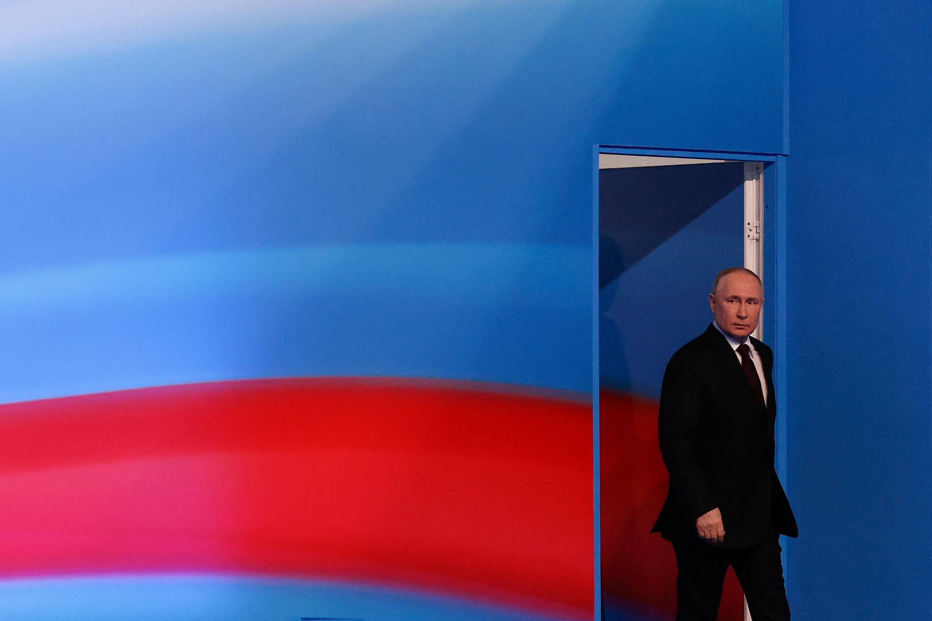 Russian presidential candidate and incumbent President Vladimir Putin arrives to speak after polling stations closed, in Moscow