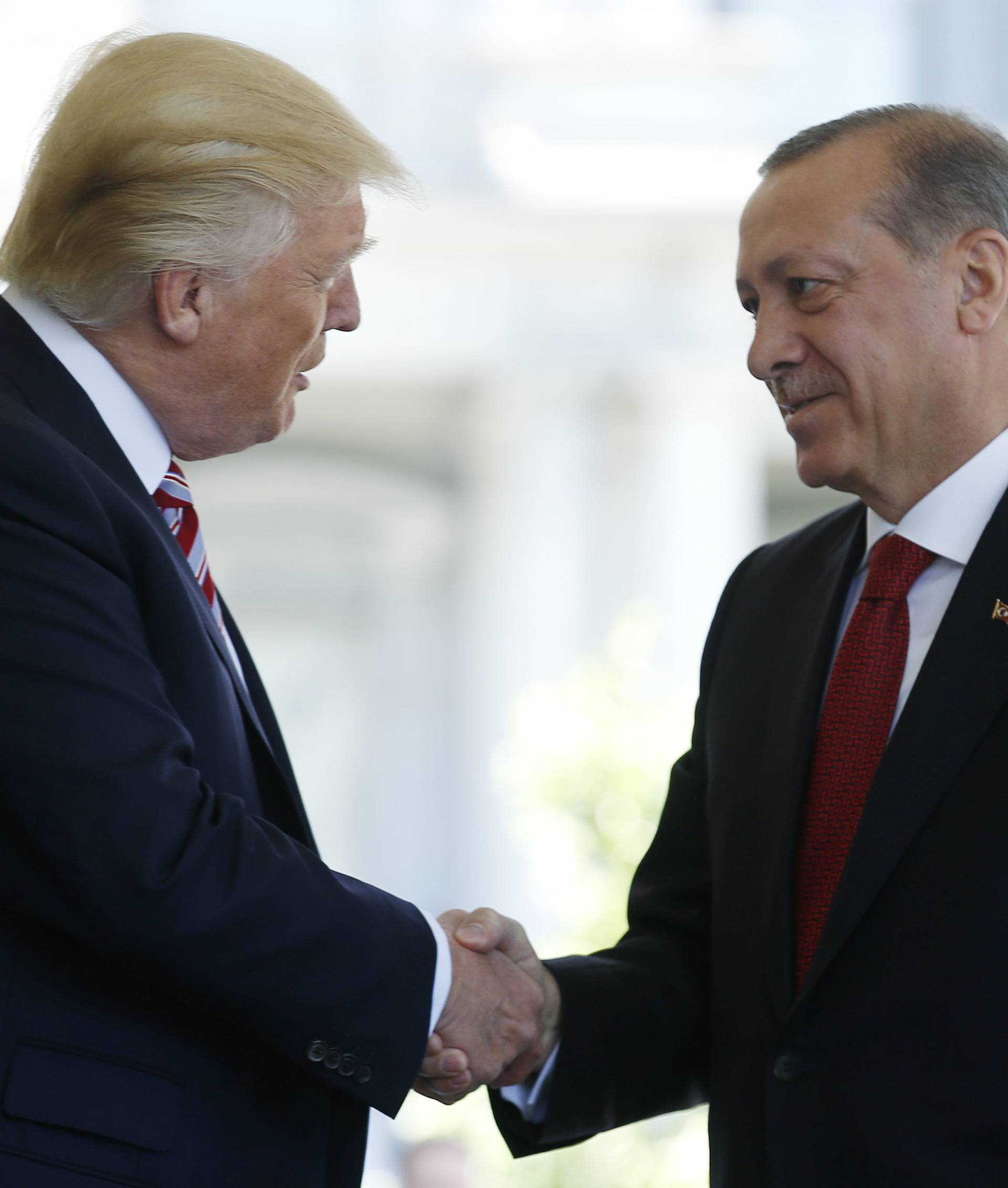President Trump greets Turkey's President Erdogan at the entrance to the West Wing of the White House in Washington