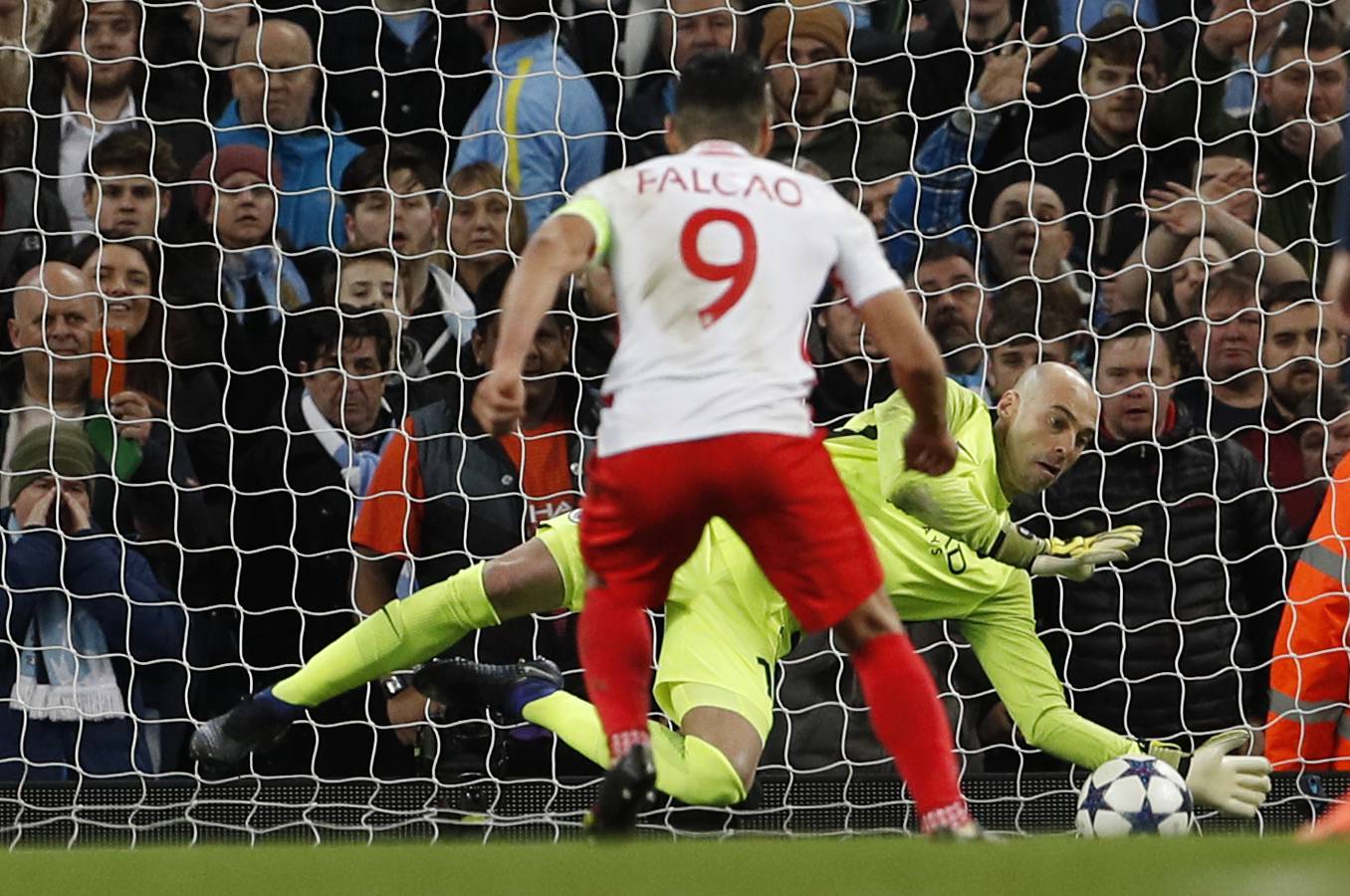 Manchester City's Willy Caballero saves a penalty from Monaco's Radamel Falcao