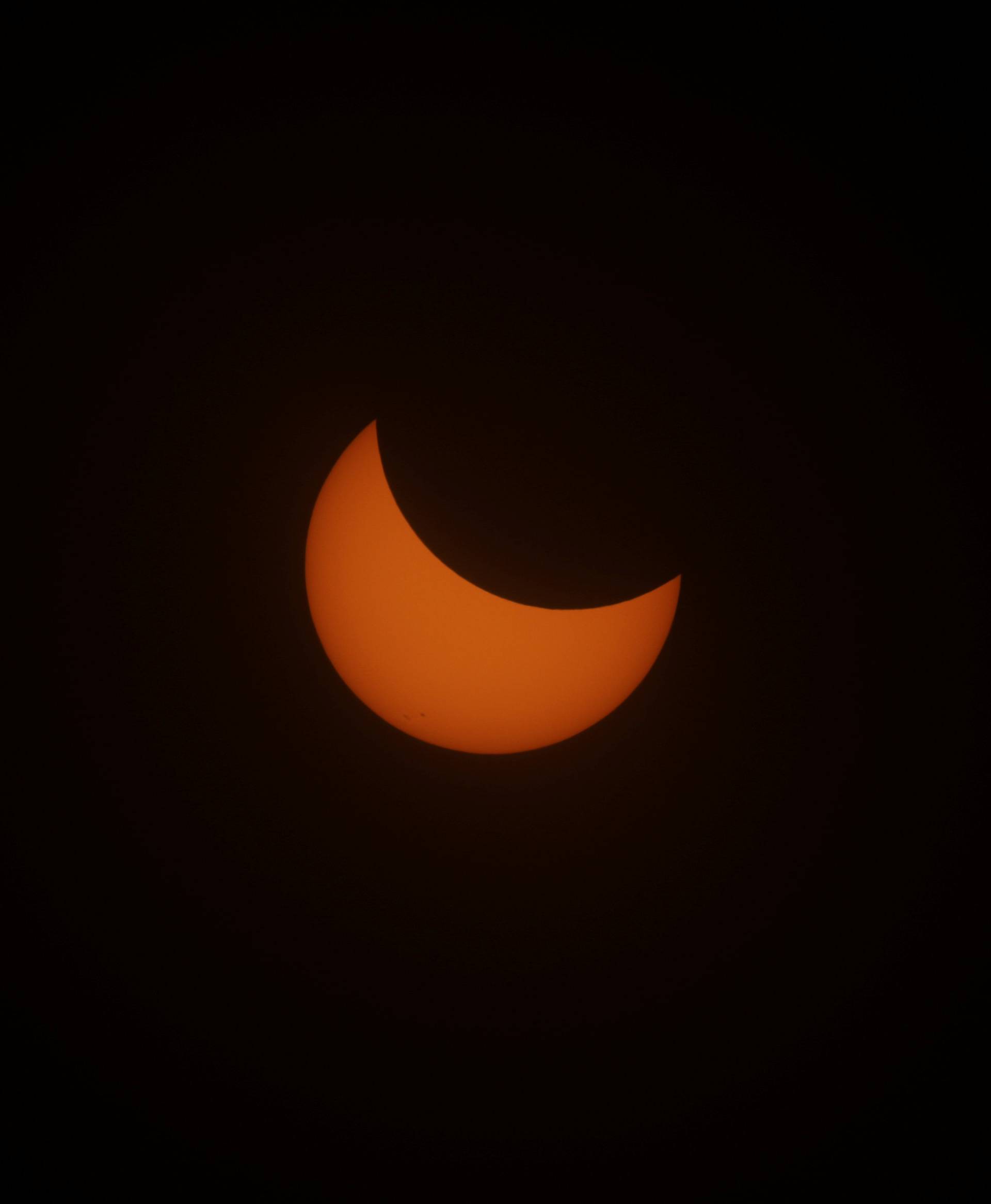 The sun is obscured during the solar eclipse in Depoe Bay