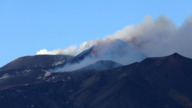 Mount Etna, Europe's highest and most active volcano, erupts and shoots plumes of smoke