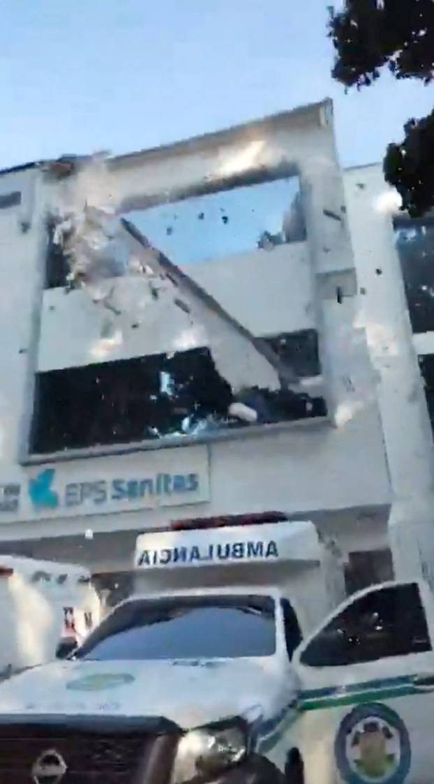 A part of an emergency services building facade falls down during an earthquake in Cali