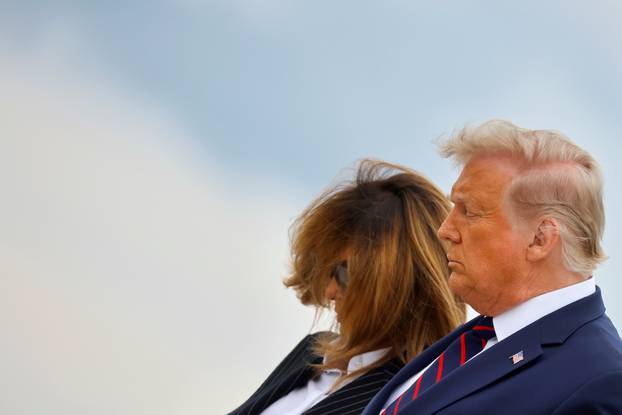 U.S. President Donald Trump and first lady Melania Trump as they arrive at Cleveland Hopkins International Airport to participate in the first presidential debate with Democratic presidential nominee Joe Biden in Cleveland, Ohio