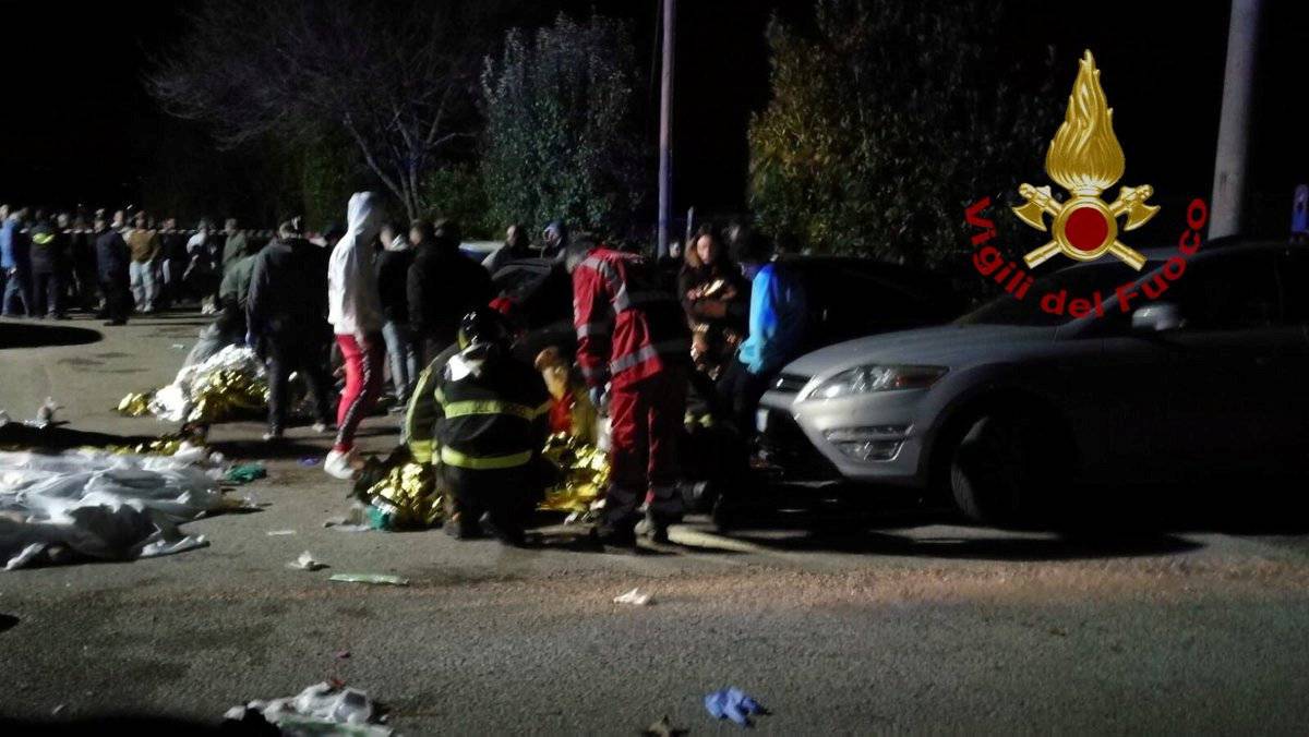 Emergency personnel attend to victims of a stampede at a nightclub in Corinaldo, near Ancona, Italy