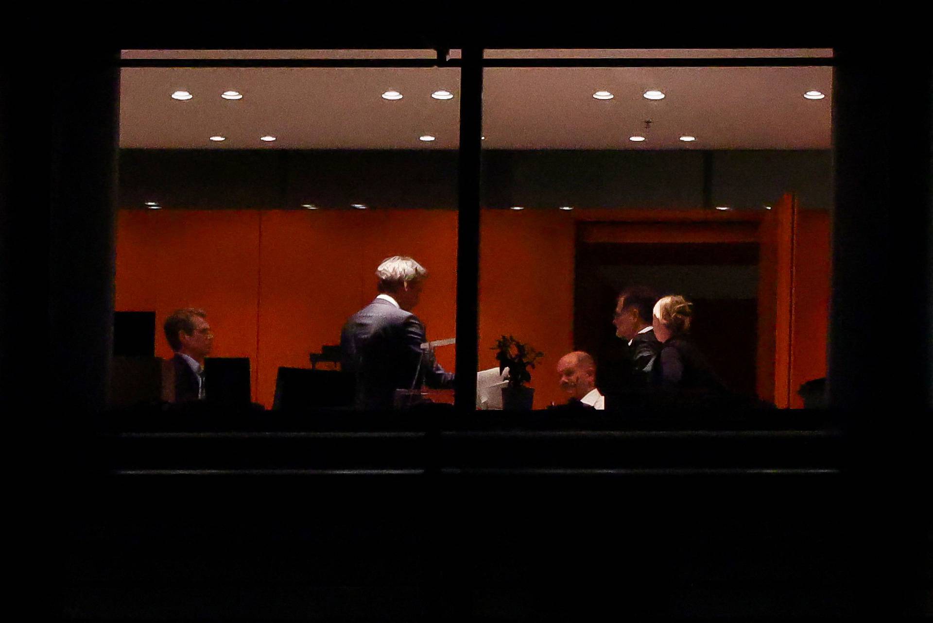 German Chancellor Scholz is seen in the Chancellor's office before a coalition meeting, in Berlin