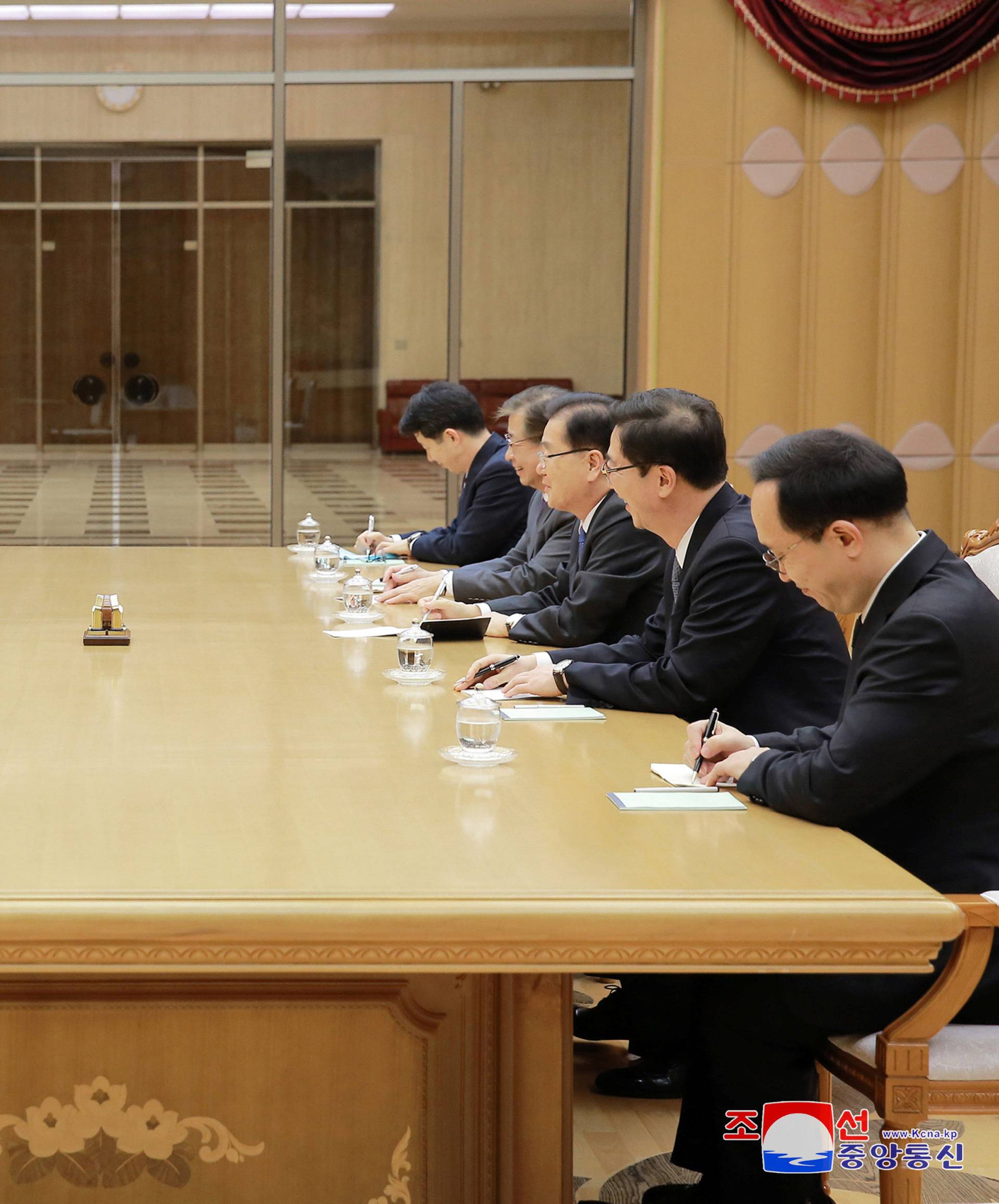 North Korean leader Kim Jong Un meets members of the special delegation of South Korea's President in this photo released by North Korea's Korean Central News Agency