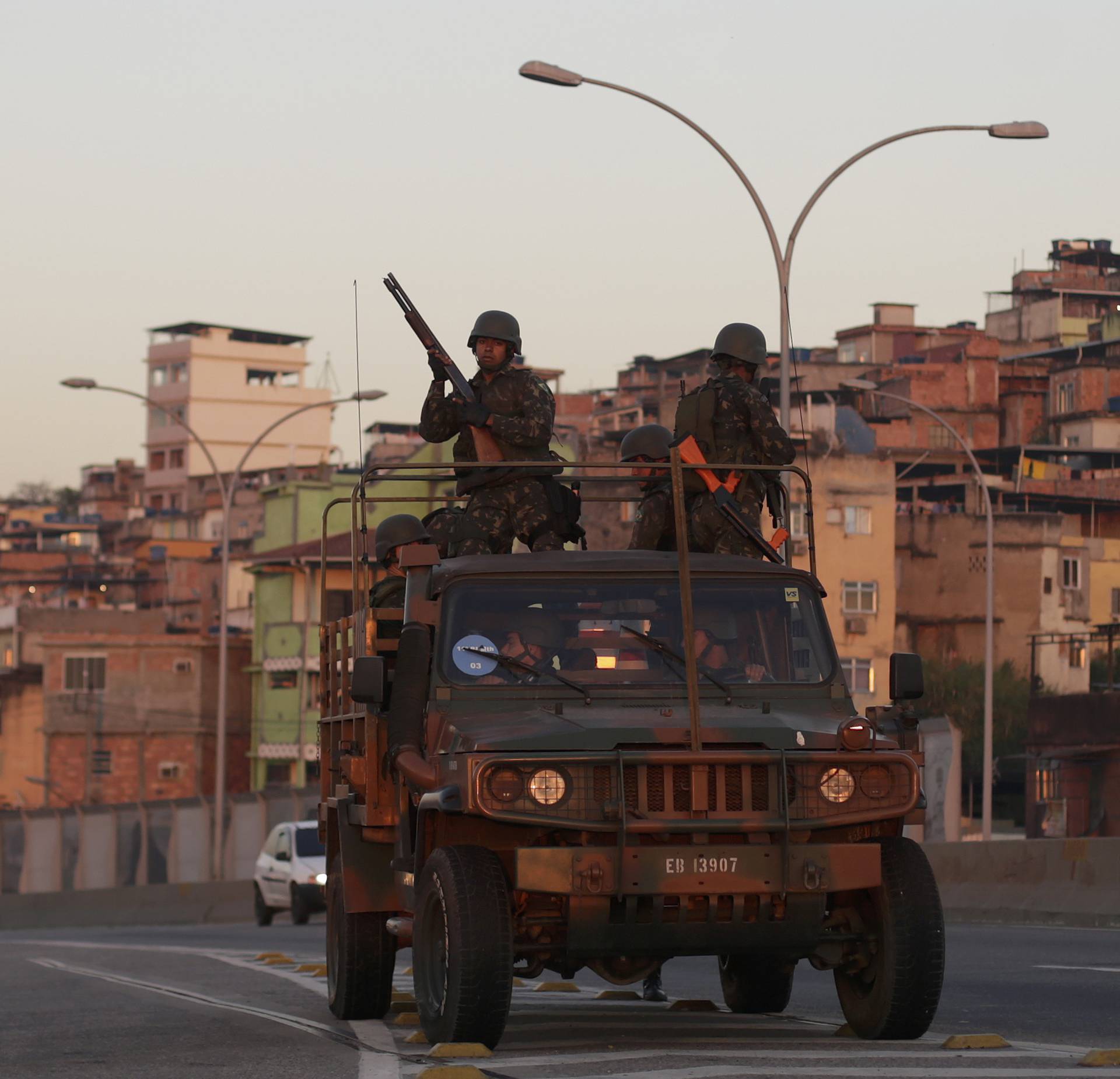 Brazilian soldiers patrol near the Complexo do Mare favela in Rio de Janeiro