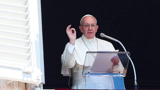 Pope Francis gestures during his Sunday Angelus prayer in Saint Peter's square at the Vatican