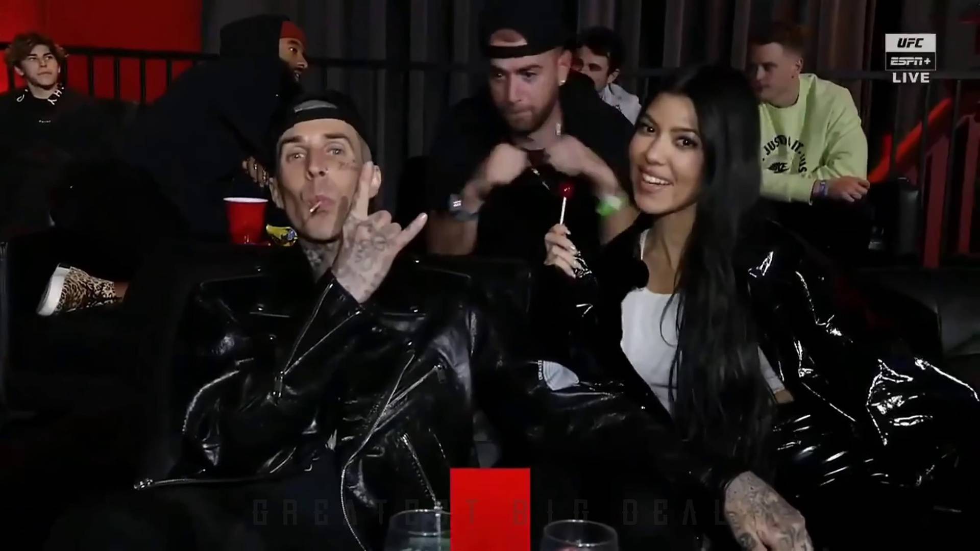 Travis Barker and Kourtney Kardashian along with Machine Gun Kelly and Megan Fox cage side for UFC 260