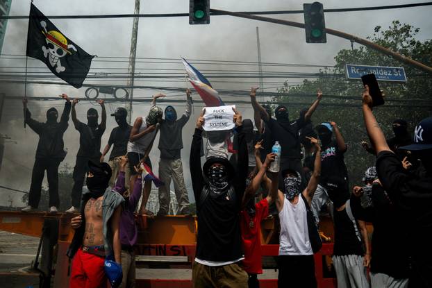 Filipinos protest to denounce what they say is corruption linked to flood control projects, in Manila