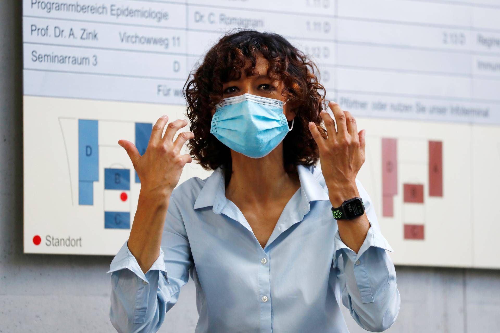 Scientist Emmanuelle Charpentier, director of the Max Planck Institute for Infection Biology in Berlin puts on a protective face mask, after winning the 2020 Nobel Prize in Chemistry for the development of a method for genome editing, in Berlin
