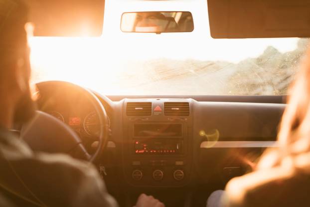 back view couple going road trip. High quality photo
