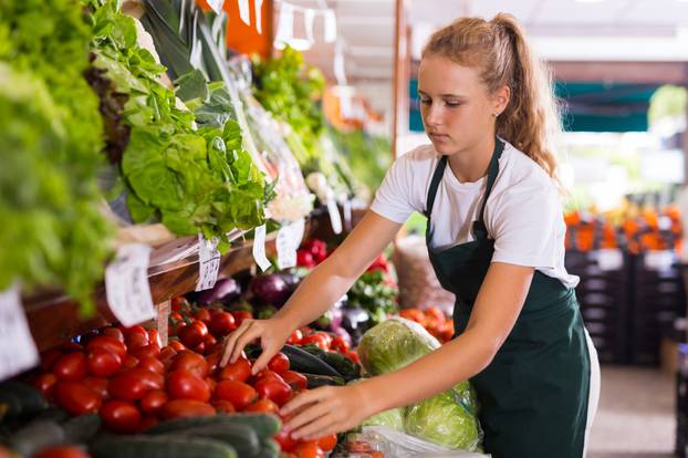 Blonde,Female,Seller,In,Uniform,Working,In,Supermarket,At,Her