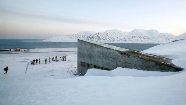 FILE PHOTO: Television crews stand outside the Global Seed Vault before the opening ceremony in Longyearbyen