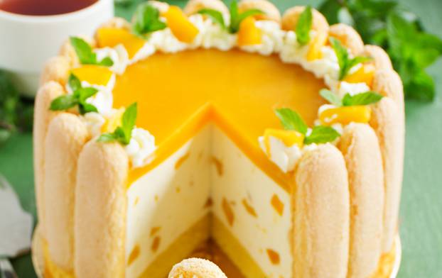 Delicious pound cake "Charlotte" with mango and peaches.