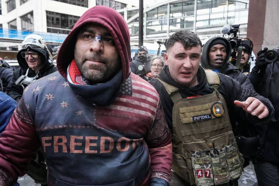 People attend the "March Against Minnesota Fraud" in Minneapolis