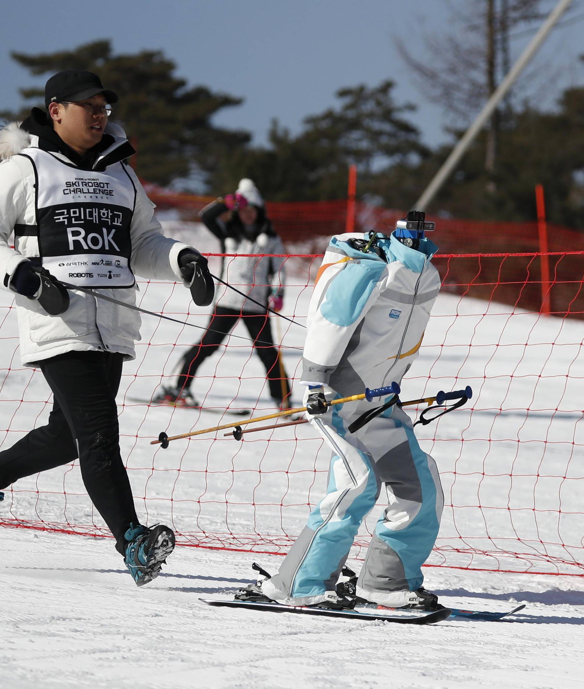 A robot skis during practice at the Ski Robot Challenge at a ski resort in Hoenseong