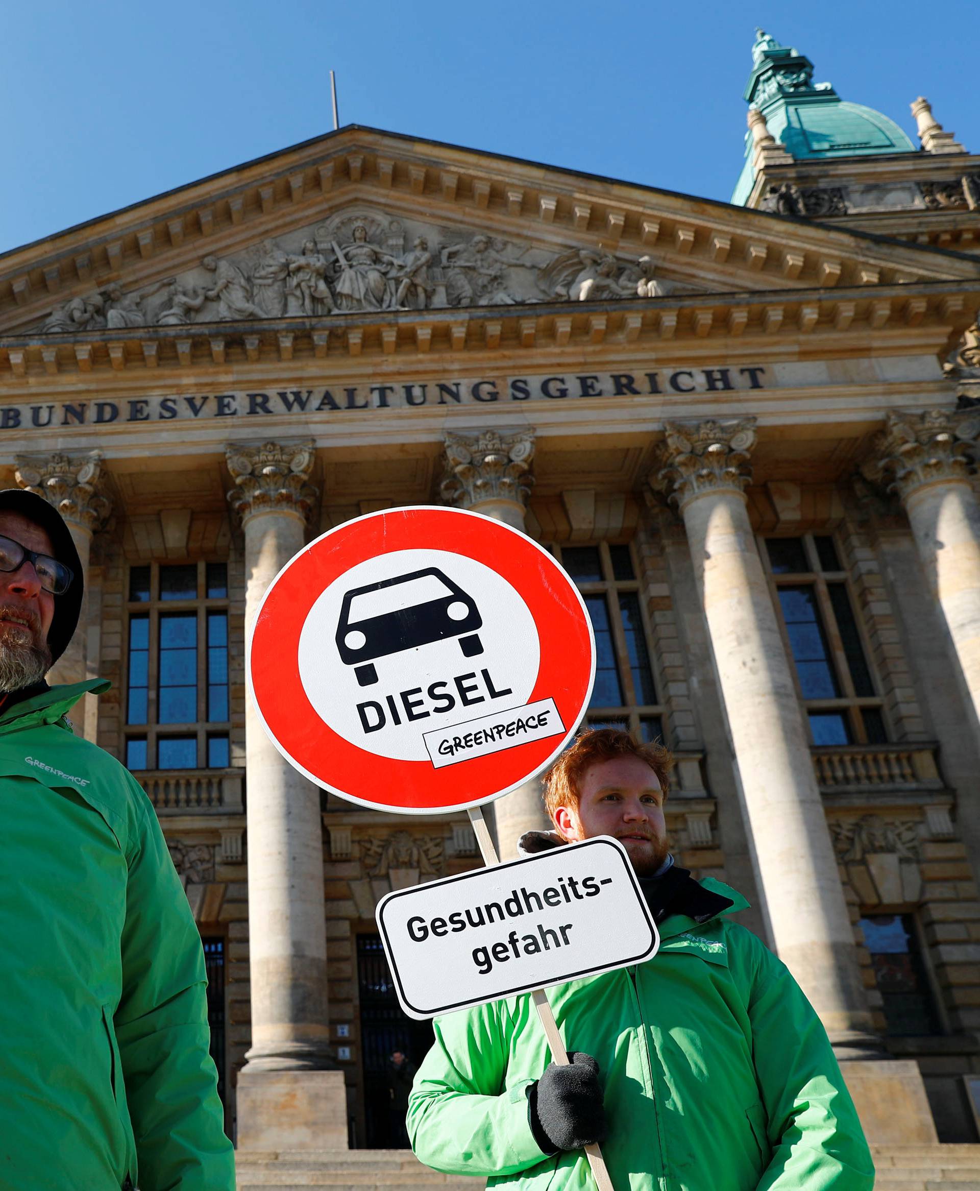 Greenpeace environmental activists protest in front of Germany's Federal Administrative Court in Leipzig