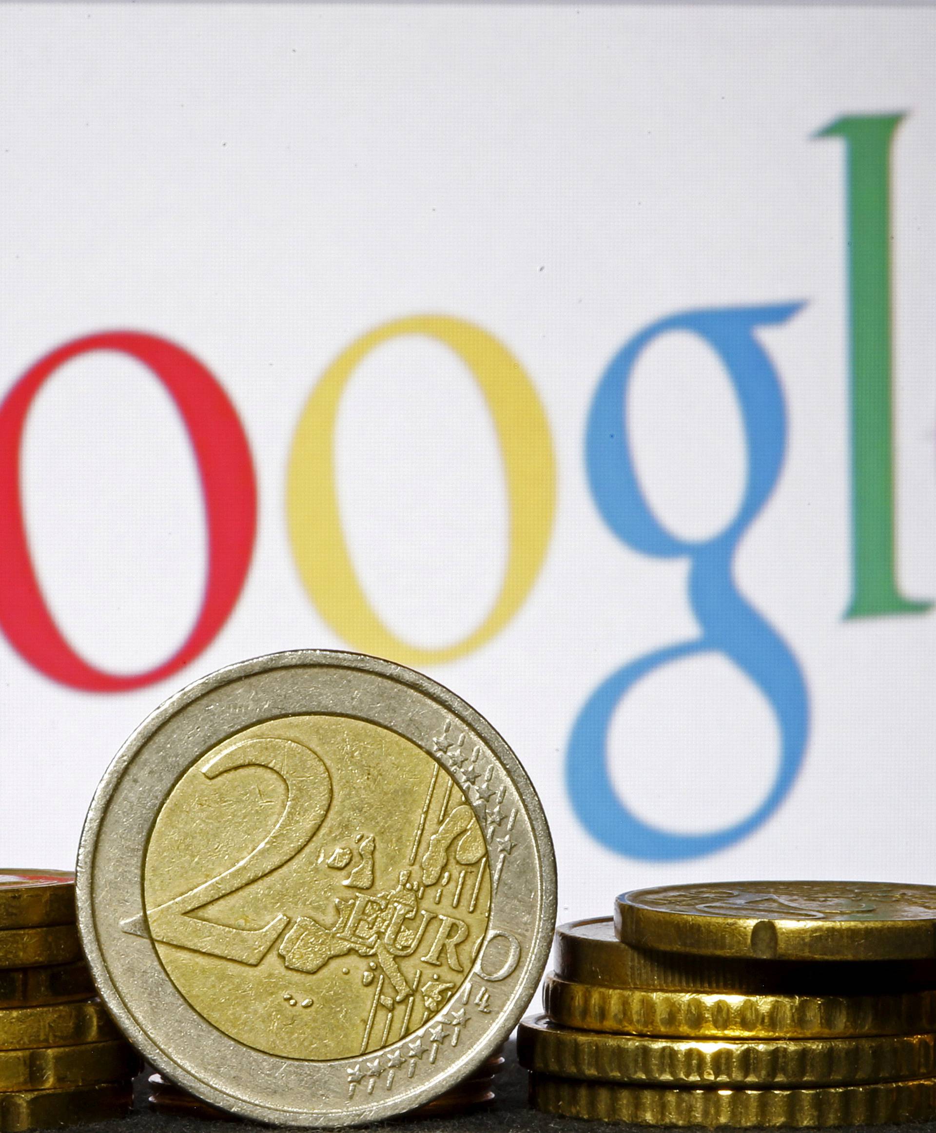 FILE PHOTO: Euro coins are seen in front of a Google logo in this picture illustration