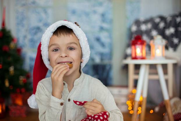 Cute,Preschool,Child,,Boy,,Reading,A,Book,And,Eating,Cookies