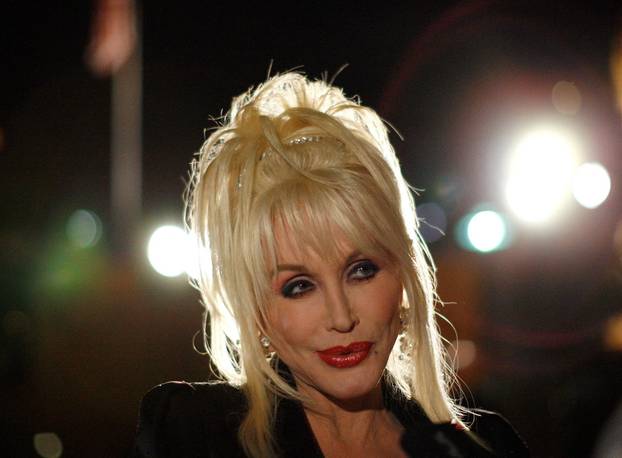 FILE PHOTO: Composer and lyricist Parton attends the party following the opening night of "9 to 5: The Musical" in Los Angeles