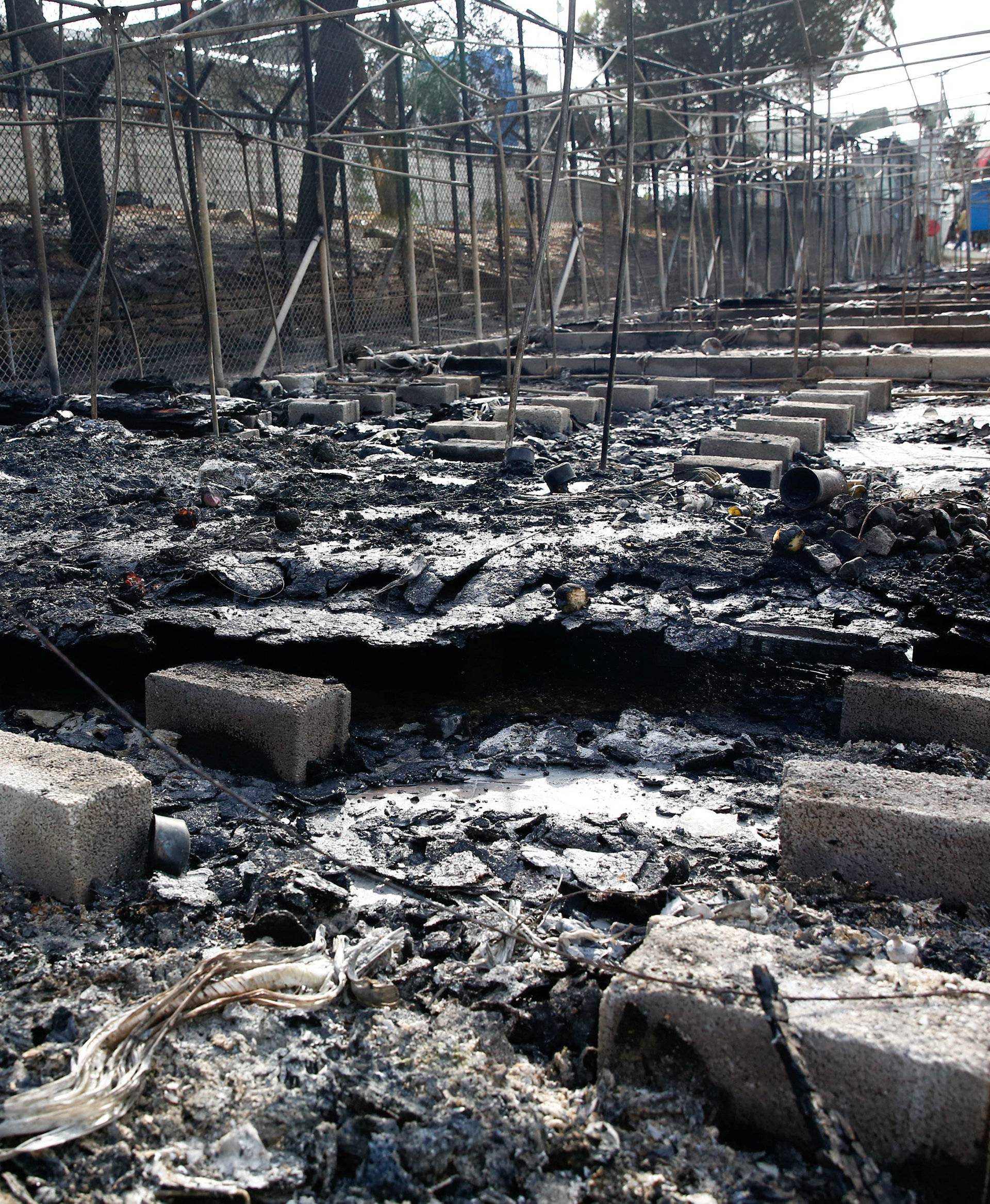 The remains of a burned tent at the Moria migrant camp, after a fire that ripped through tents and destroyed containers during violence among residents, on the island of Lesbos