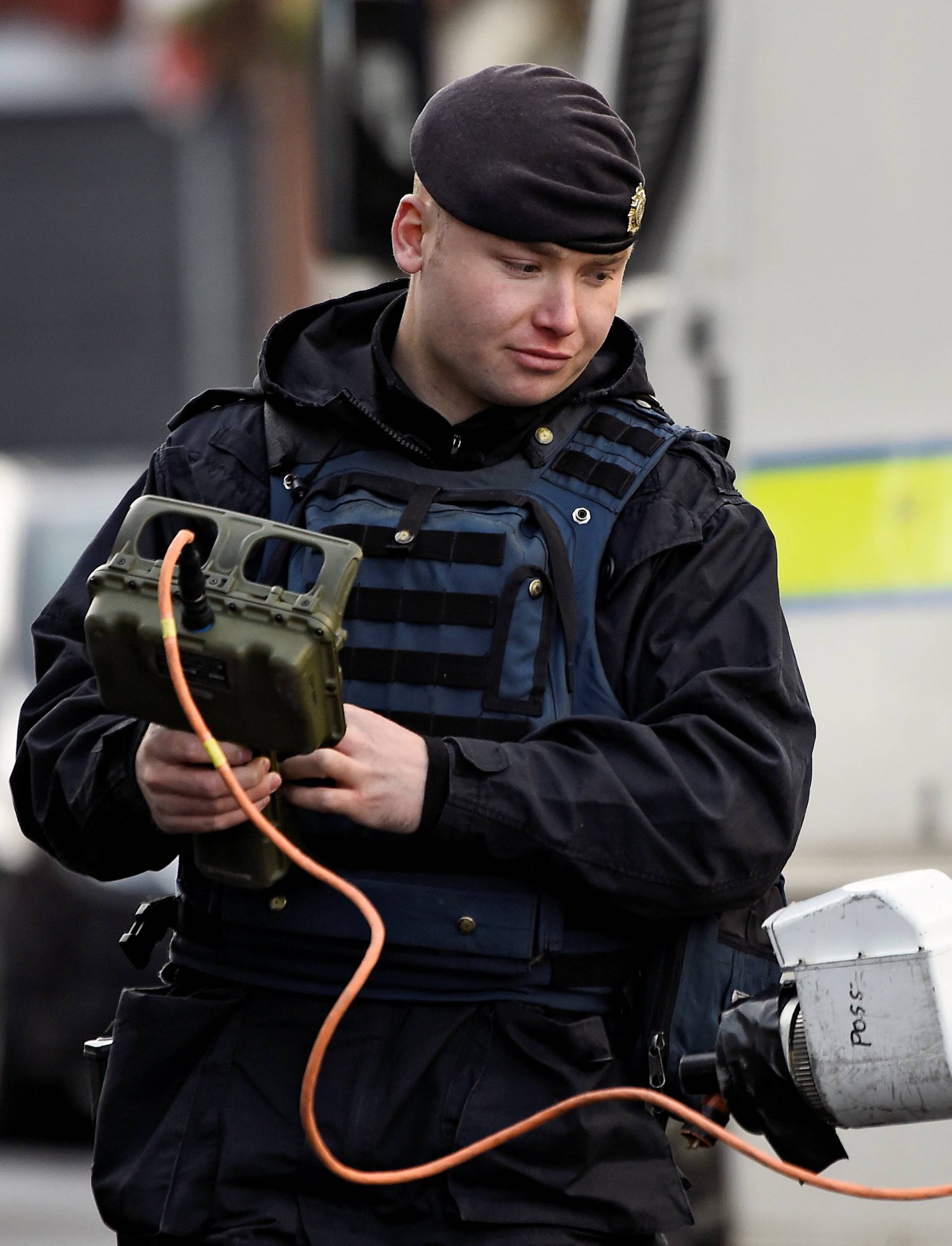 Soldier deploys a mechanical bomb defuser at the scene of a suspected car bomb in Londonderry