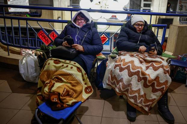 People take shelter inside a metro station during overnight Russian missile and drone attack, in Kyiv