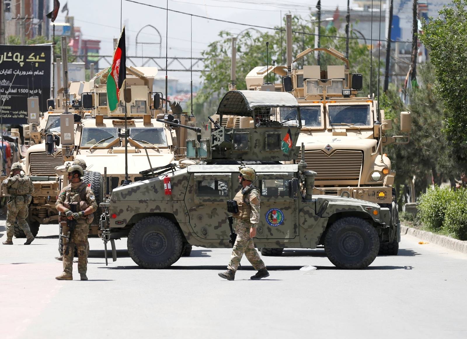 FILE PHOTO: Afghan security forces stand guard outside a hospital which came under attack in Kabul