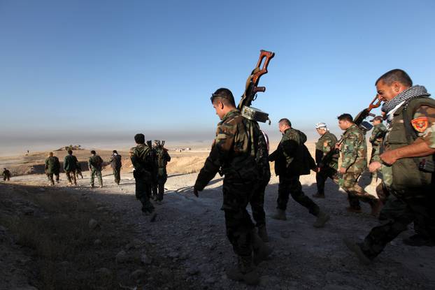 Peshmerga forces walk in the east of Mosul during operation to attack Islamic State militants in Mosul
