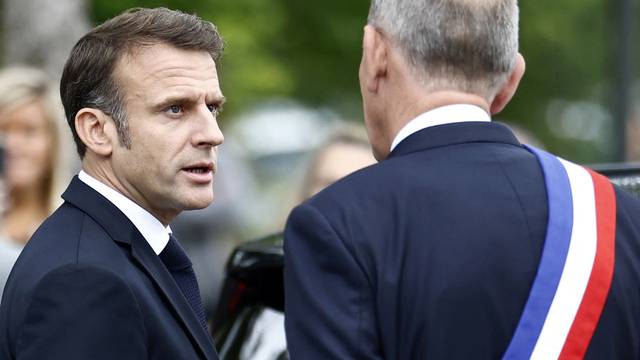 French President Macron votes in the second round of French parliamentary elections