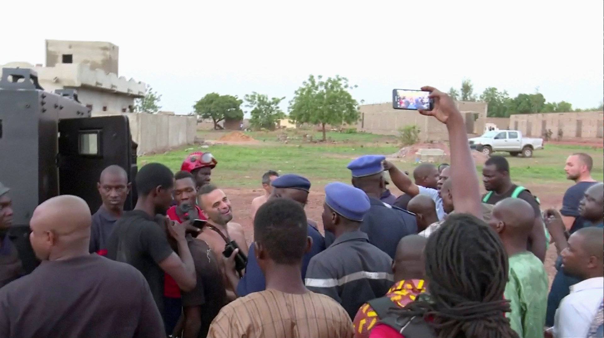 Police with four people rescued from the Le Campement Kangaba resort following an attack where gunmen stormed the resort in Dougourakoro, to the east of the capital Bamako, Mali in this still frame taken from video