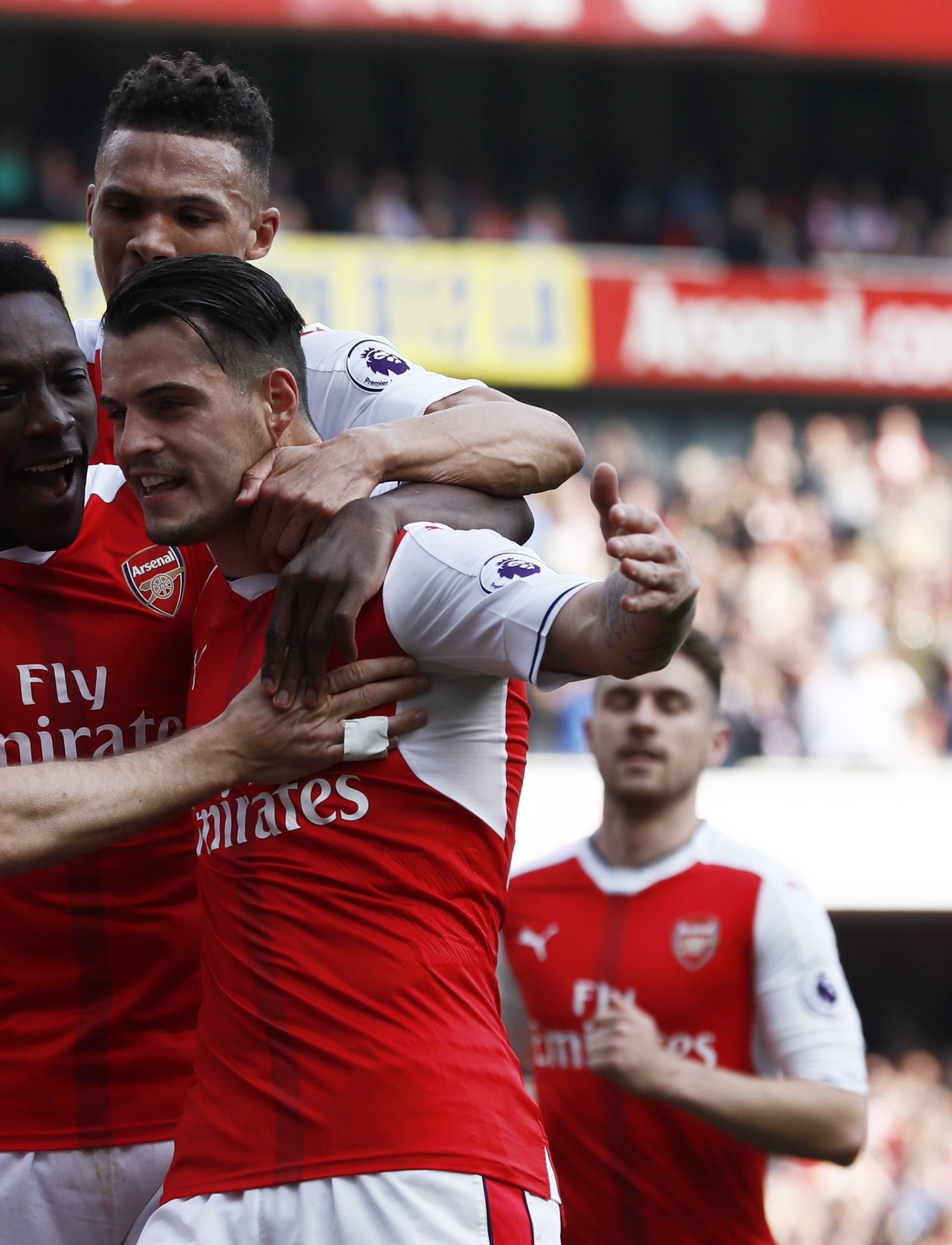 Arsenal's Granit Xhaka celebrates scoring their first goal with teammates